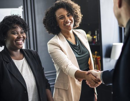 Business partners shaking hands in agreement